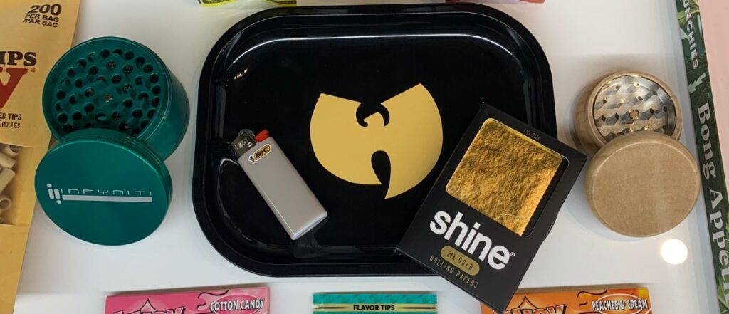 Cannabis rolling papers, rolling tray, and lighter.