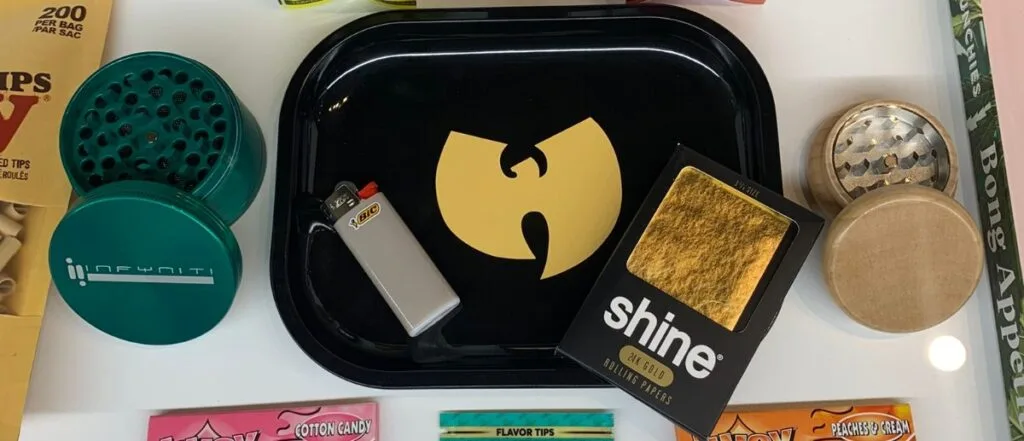 Cannabis accessories, rolling tray, mixer, lighter, and Shine rolling papers